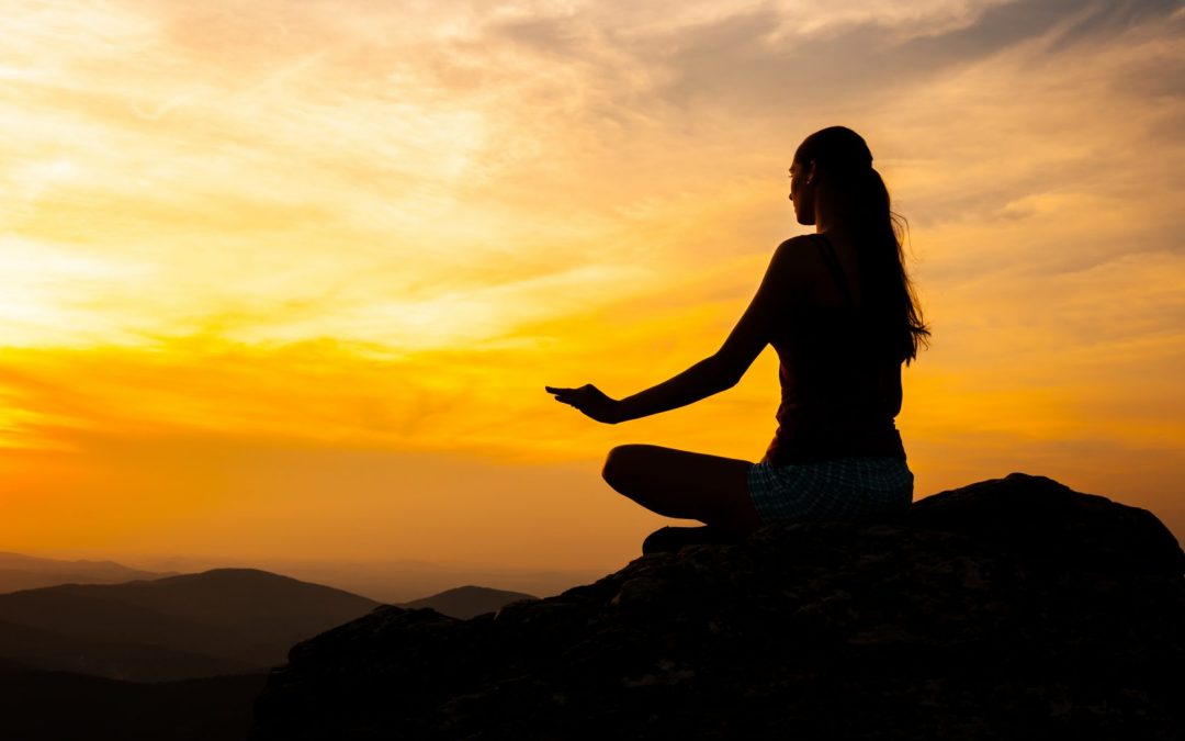 Yoga practicioner in sunset