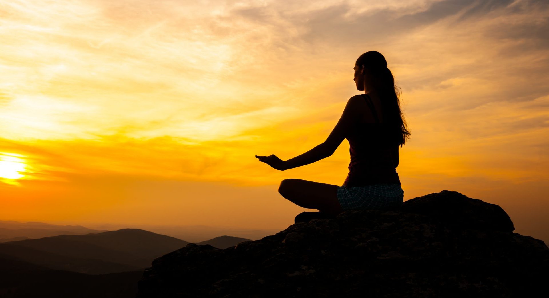 Yoga practicioner in sunset